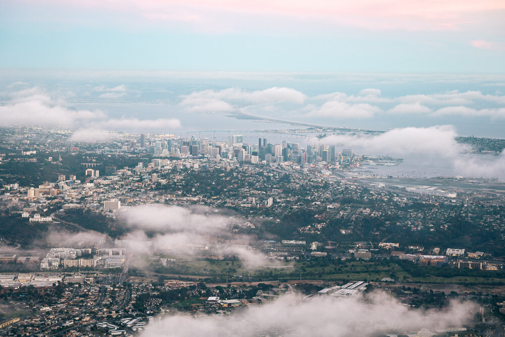 Aerial view of downtown San Diego skyline and bay at dusk